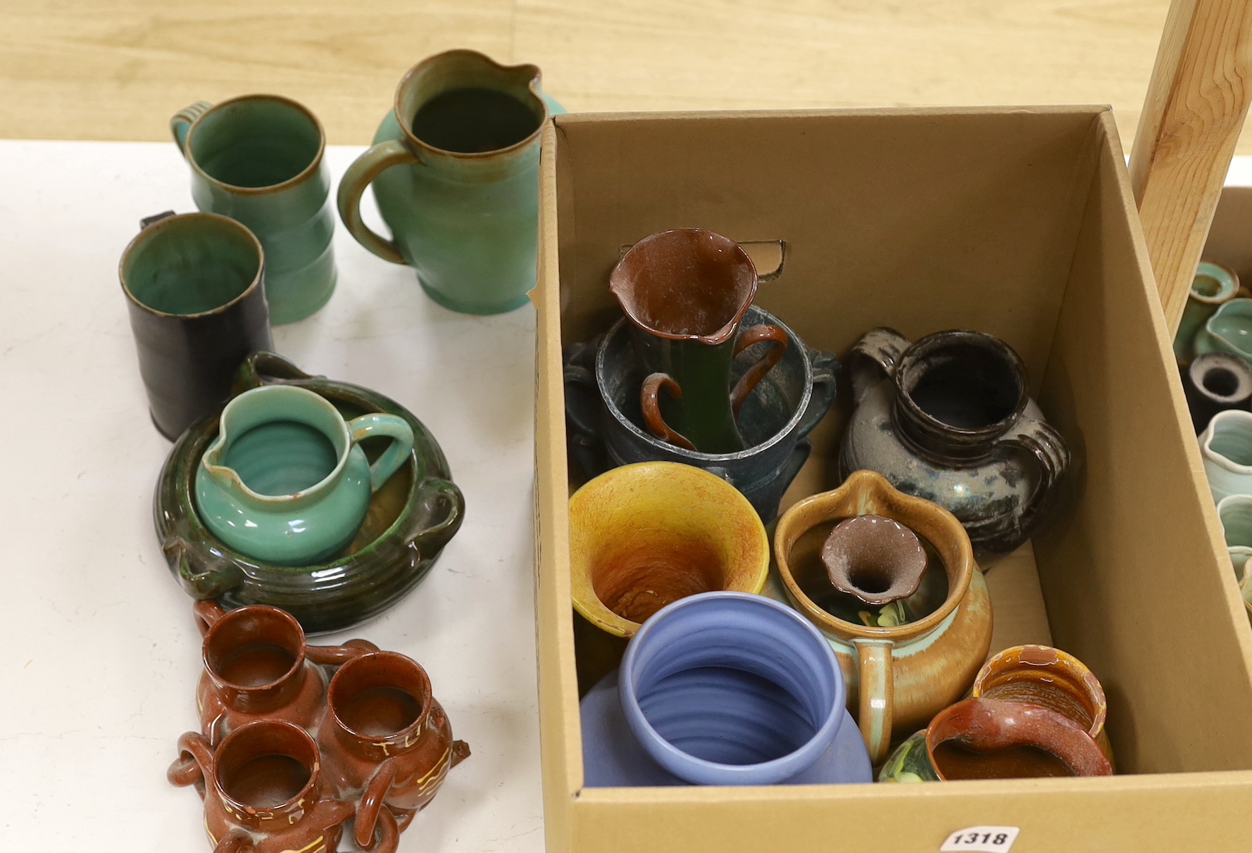 A large collection of assorted glazed Dickerware vases, jugs and pots
